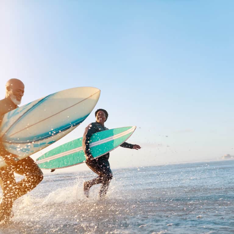 Older Couple Enjoying Renewed Health Surfing